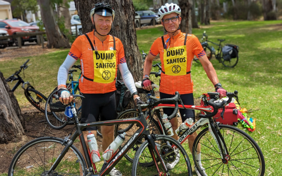 XR SA riders cross TDU race finish line wearing ‘DUMP SANTOS’ message